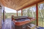 In The Snow Lodge  deck with large hot tub.